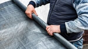 Vapour barrier membrane installation for moisture control and fire protection in building construction