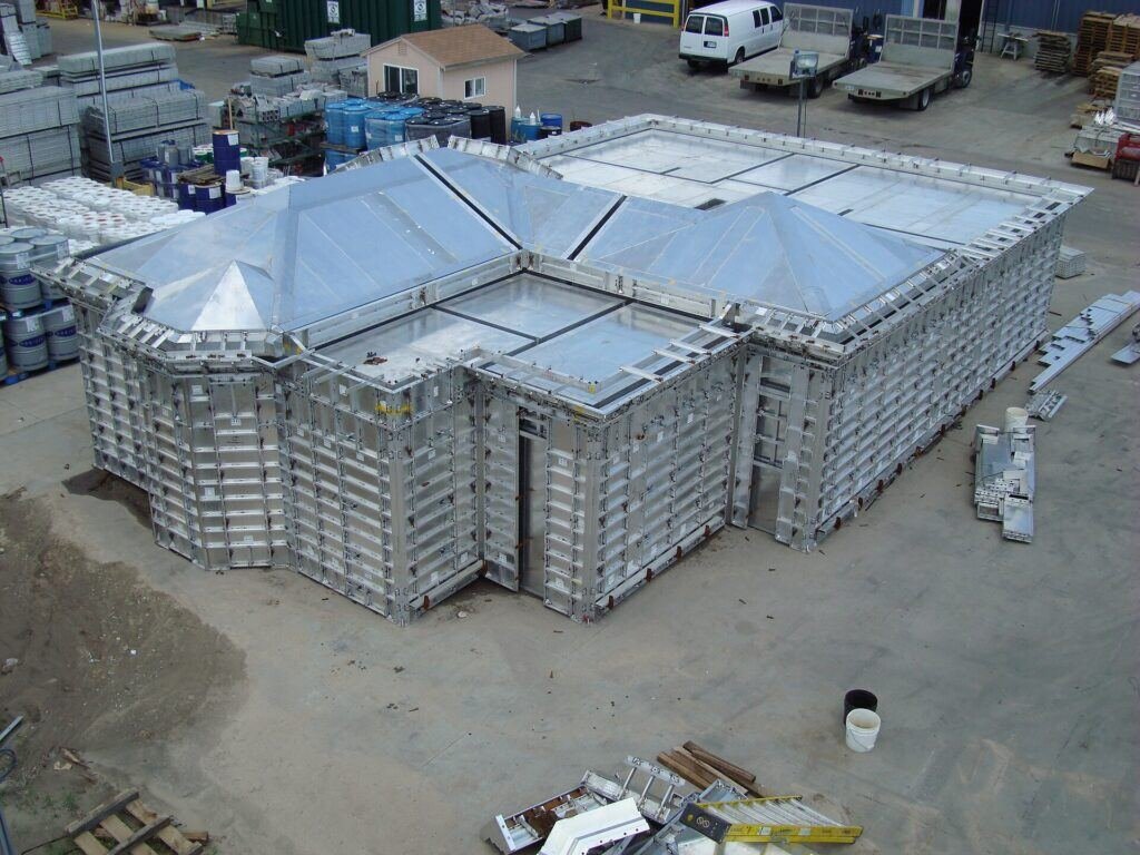Concrete formwork shuttering supported by props on a building site