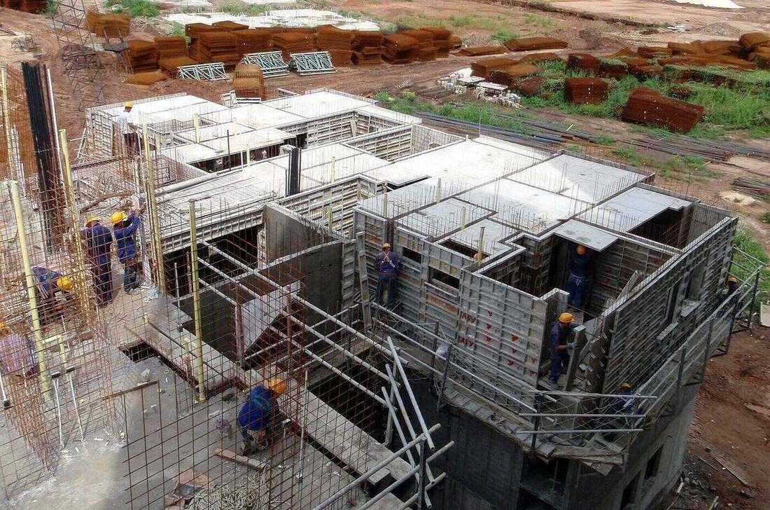 Formwork panels set out on a slab following the structural layout