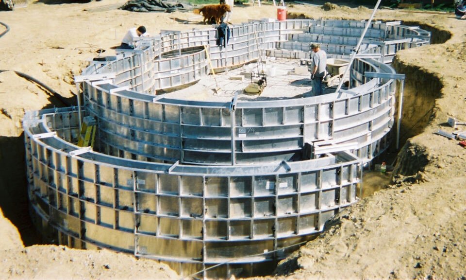 Formwork panels forming wall faces and a deck before a concrete pour