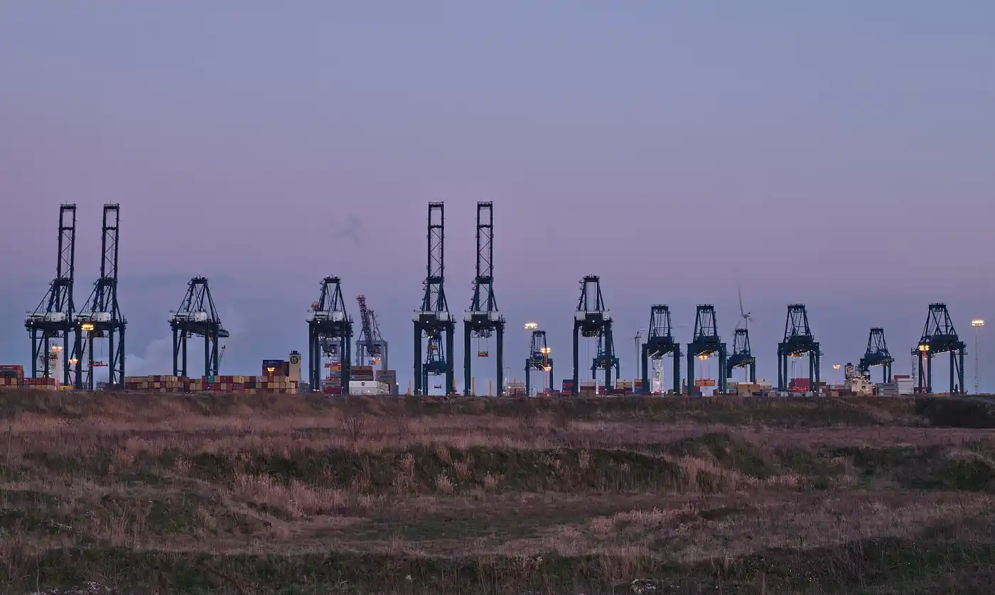 Container cranes loading freight at a European container terminal