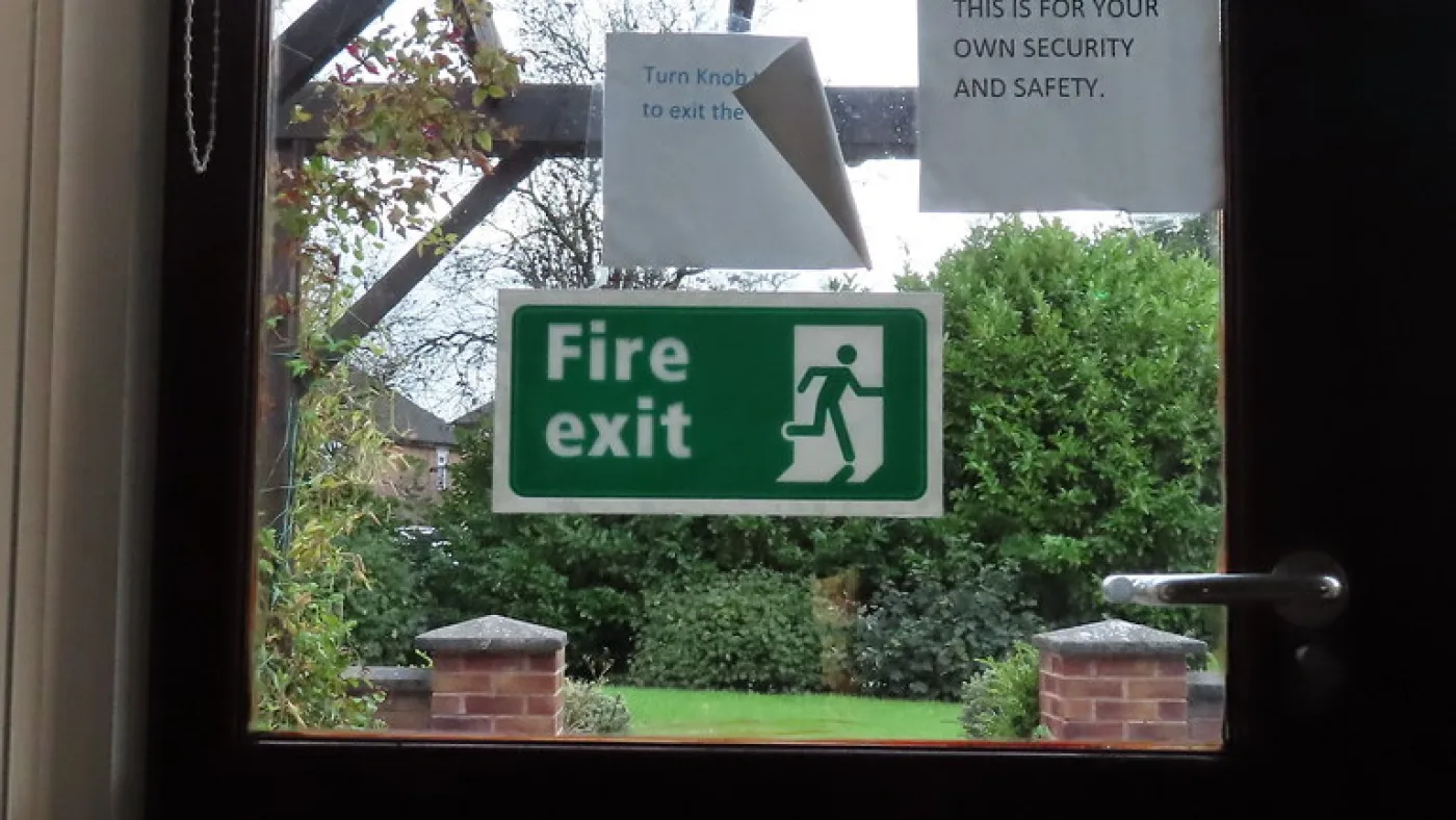 A marked fire door in a building corridor