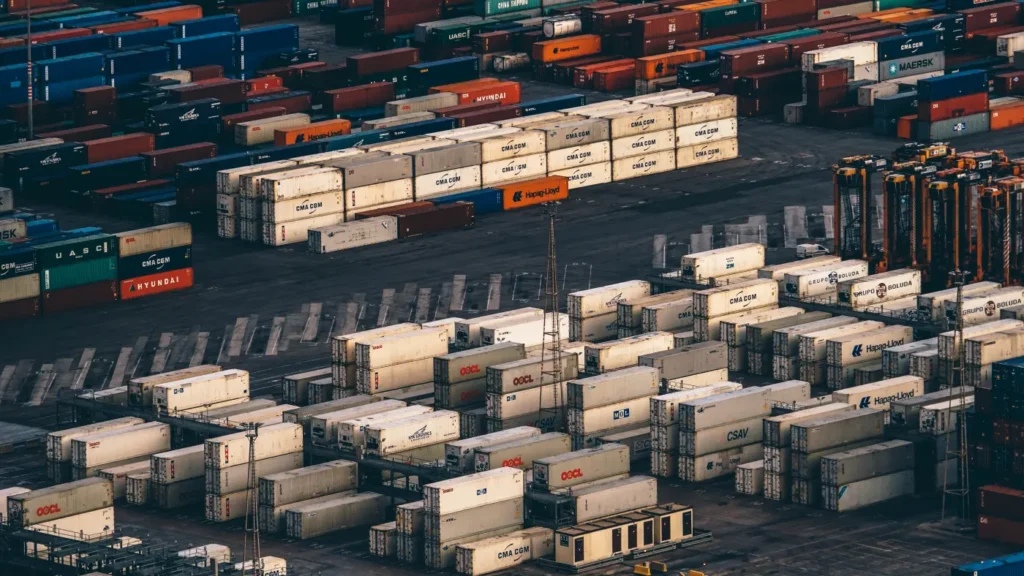 Shipping containers stacked at a port terminal awaiting loading